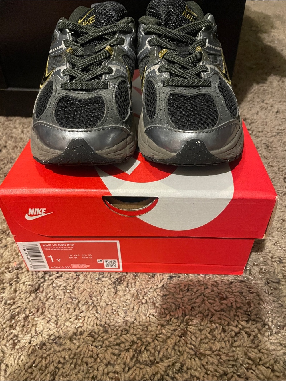 Nike Kids Black and Gray Sneakers with Gold Accents